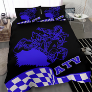 Black bedding set with blue graphics and 'ATV' text on a bed in a bedroom.