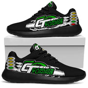 Black custom drag racing sneakers displayed on a white box, with green-and-white Carlos Tuning sample logos, tire tracks, and starting lights.