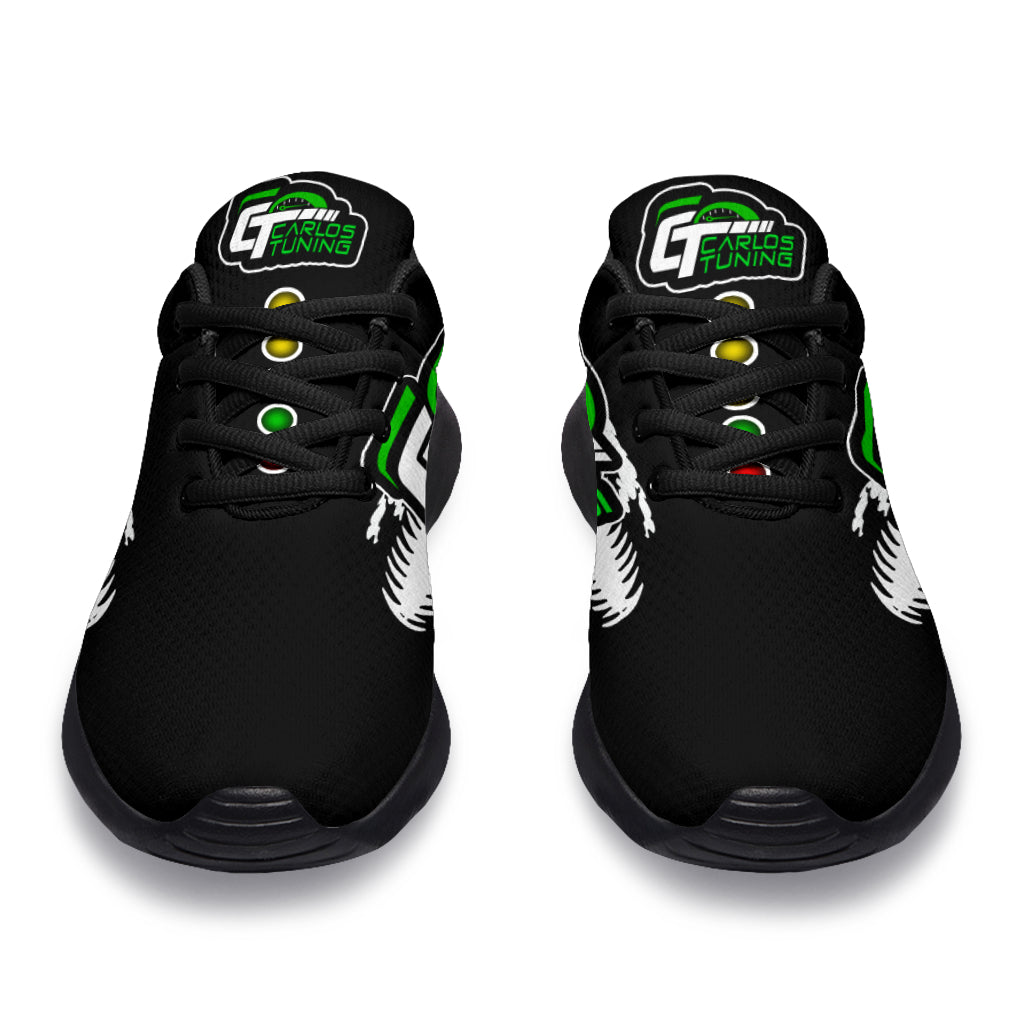 Front view of black custom drag racing sneakers with lace-up closures, Carlos Tuning sample tongue logos, and colored starting lights.