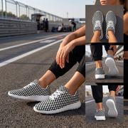 Black-and-white checkered sneakers with white soles worn trackside, with inset top, heel, and outsole views.