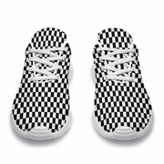 Top view of a pair of black-and-white checkered sneakers showing white laces and rounded toes.