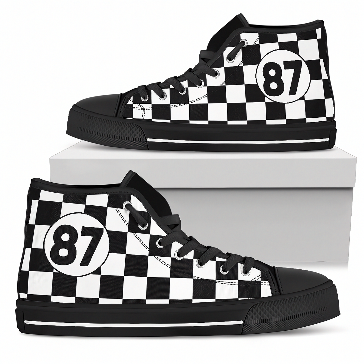 A pair of high-top sneakers with a black rubber sole and laces, featuring a beige and brown geometric Southwestern-style pattern on the canvas uppers, displayed on and around a white shoebox against a white background.