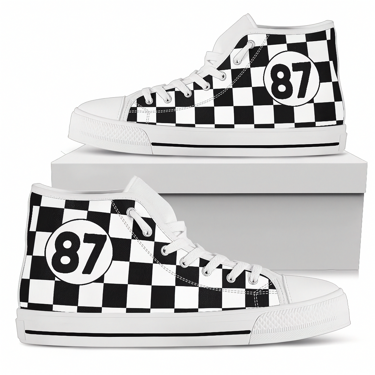 Black high-top sneakers with white polka dots on a white background