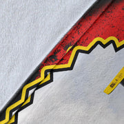 Close-up of the blanket’s white microfleece backing, stitched edge and yellow-bordered photo print.