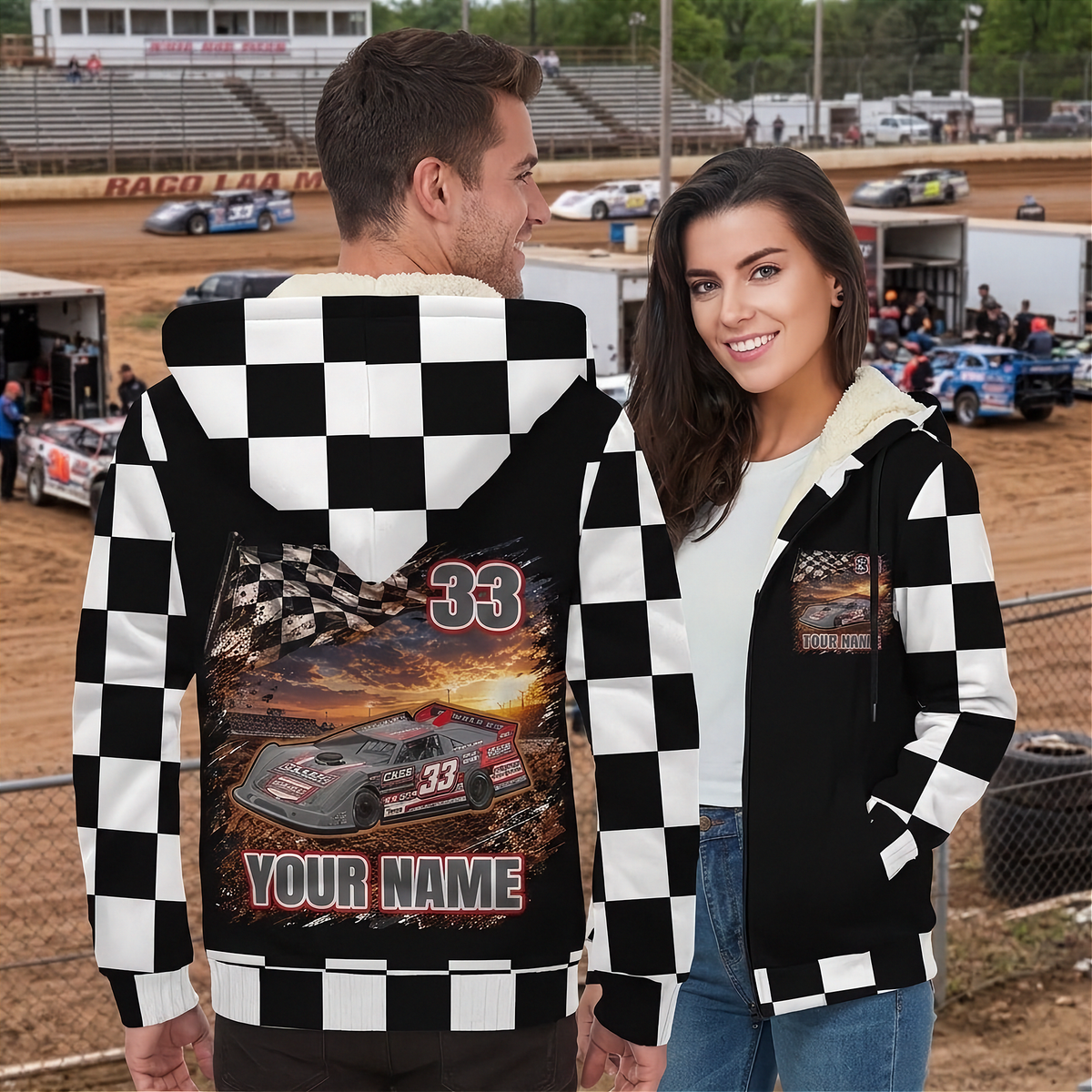 Couple at a dirt track showing the late model jacket’s personalized back artwork and matching chest graphic.