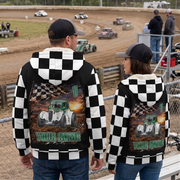 Couple watching Legends racing in matching checkered sherpa jackets with green-and-white car artwork and personalized back designs.