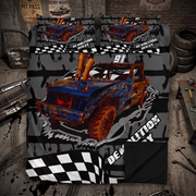 A racing-themed bedding set featuring a large blue and orange race car graphic with black and white checkered flag patterns, shown on a bed with matching pillowcases in a garage-style room setting.