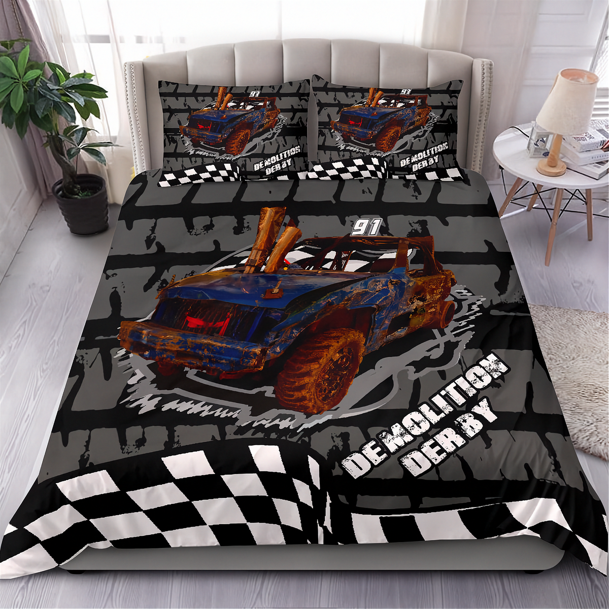 A racing-themed bedding set featuring a duvet cover and two pillowcases with a blue and orange race car graphic, black-and-white checkered flag borders, and the words 'DEMOLITION DERBY' on a bed in a styled bedroom.