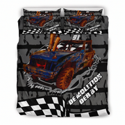 A bedding set featuring a bold graphic print of a blue and rusted off-road race car with the text 'DEMOLITION DERBY' and '91', set against a dark gray and black grunge background with checkered flag patterns.
