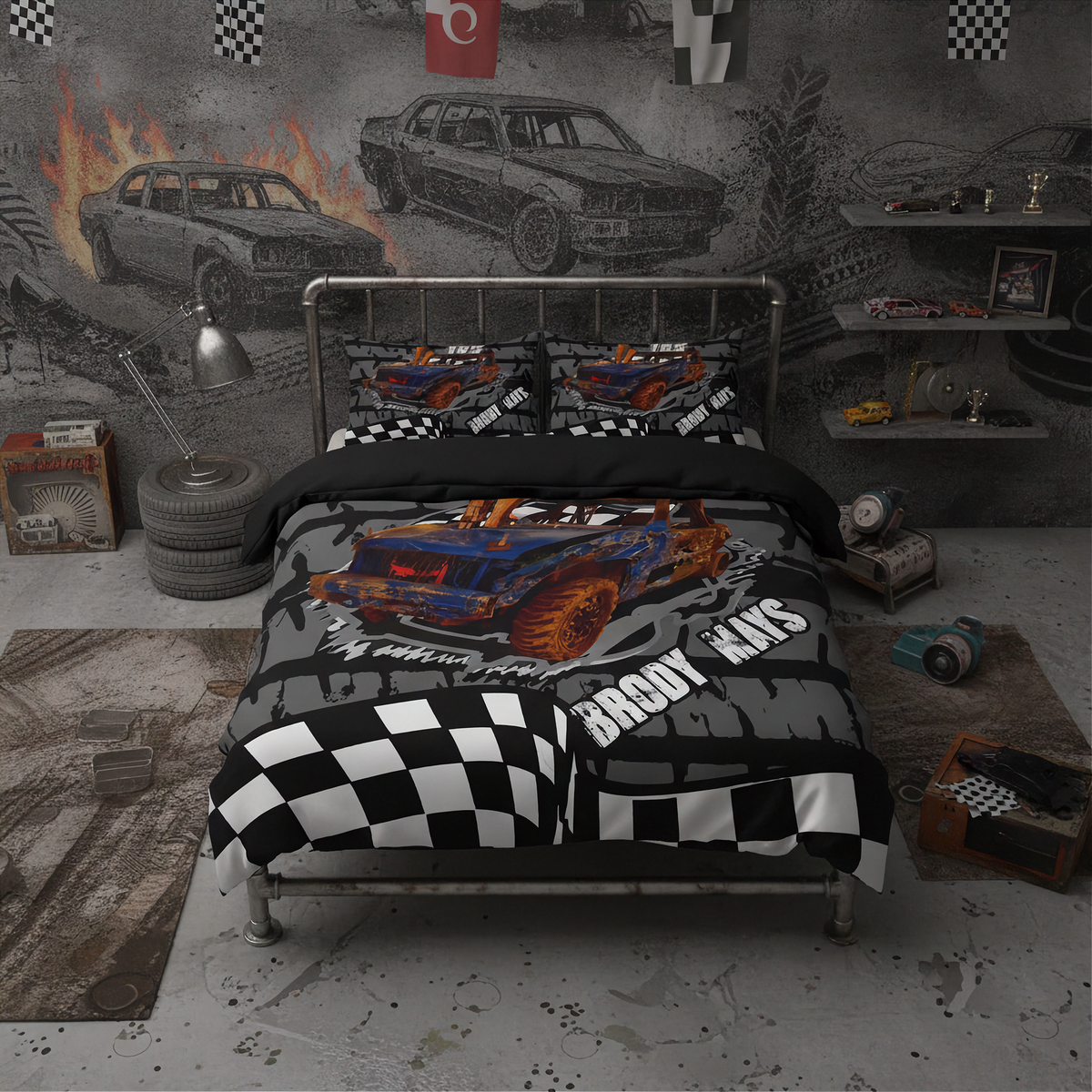 A racing-themed bedding set featuring a blue and orange race truck on a black and gray tire-track background with checkered flags and the words 'Demolition derby'. The set is displayed on a metal bed frame in a styled room with a gray concrete floor, a gray wall with car sketches, and racing props.