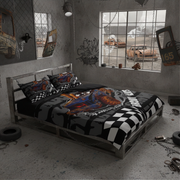 A bed dressed in a black, gray, and white racing-themed bedding set with checkered patterns and a large car graphic, placed in a gritty, industrial-style room with graffiti walls and window views.