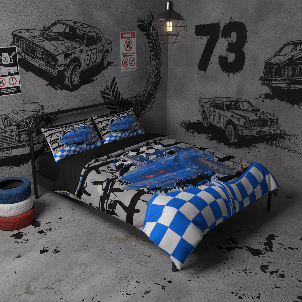 A racing-themed bedding set featuring a blue and white checkered pattern, a blue car graphic, and black-and-white distressed graphics, displayed on a bed in a styled gray room with car wall decals.