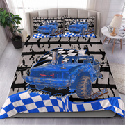 A racing-themed bedding set displayed on a bed in a styled bedroom. The set includes a duvet cover and two matching pillowcases featuring a blue demolition derby car graphic, black and white checkered stripes, and a distressed gray background.