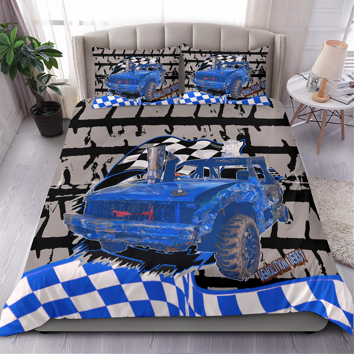 A racing-themed bedding set displayed on a bed in a styled bedroom. The set includes a duvet cover and two matching pillowcases featuring a blue demolition derby car graphic, black and white checkered stripes, and a distressed gray background.