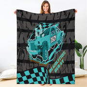 Woman holding a personalized demolition derby blanket with a blue 350Y car, checkered flags, and a dark tire-track background.