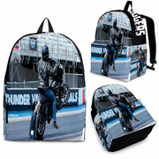 A backpack shown from multiple angles on a white background, printed with a motorcycle rider racing scene and large white 'drag racing' text on the side.