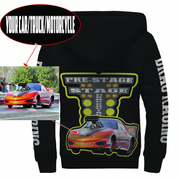Black hoodie featuring a large drag racing graphic on the front with a red race car and 'PRE-STAGE DRAG RACING' text, plus 'DRAG RACING' on the sleeve. Includes a circular inset photo of a red drag racer and callout lines explaining the graphic customization.