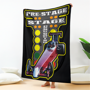 Blanket with drag racing design featuring a car and text on a black background.