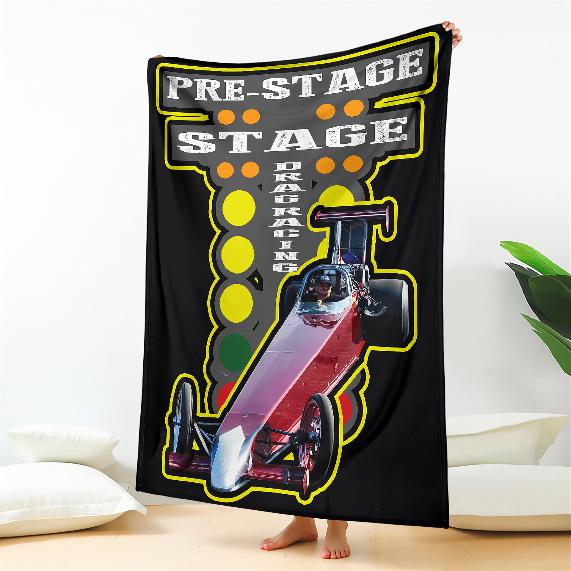 Blanket with drag racing design featuring a car and text on a black background.