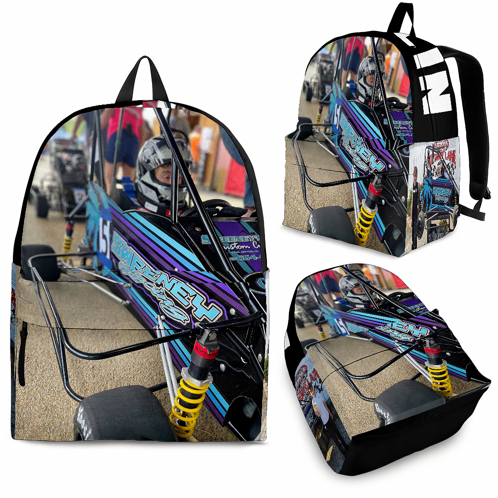 A backpack shown from multiple angles on a plain white background, printed with a detailed race car scene. The backpack has black straps and trim, and the printed artwork features a blue, purple, black, and tan race car with bright yellow suspension and racing graphics.