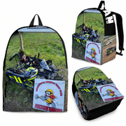 A backpack shown from multiple angles on a white background, featuring an all-over printed photo of a go-kart a on grass, with a cartoon racer sign and black side panels.
