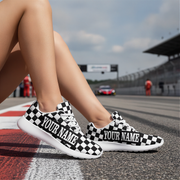 Black and white checkered sneakers with 'Your Name' text on a race track background