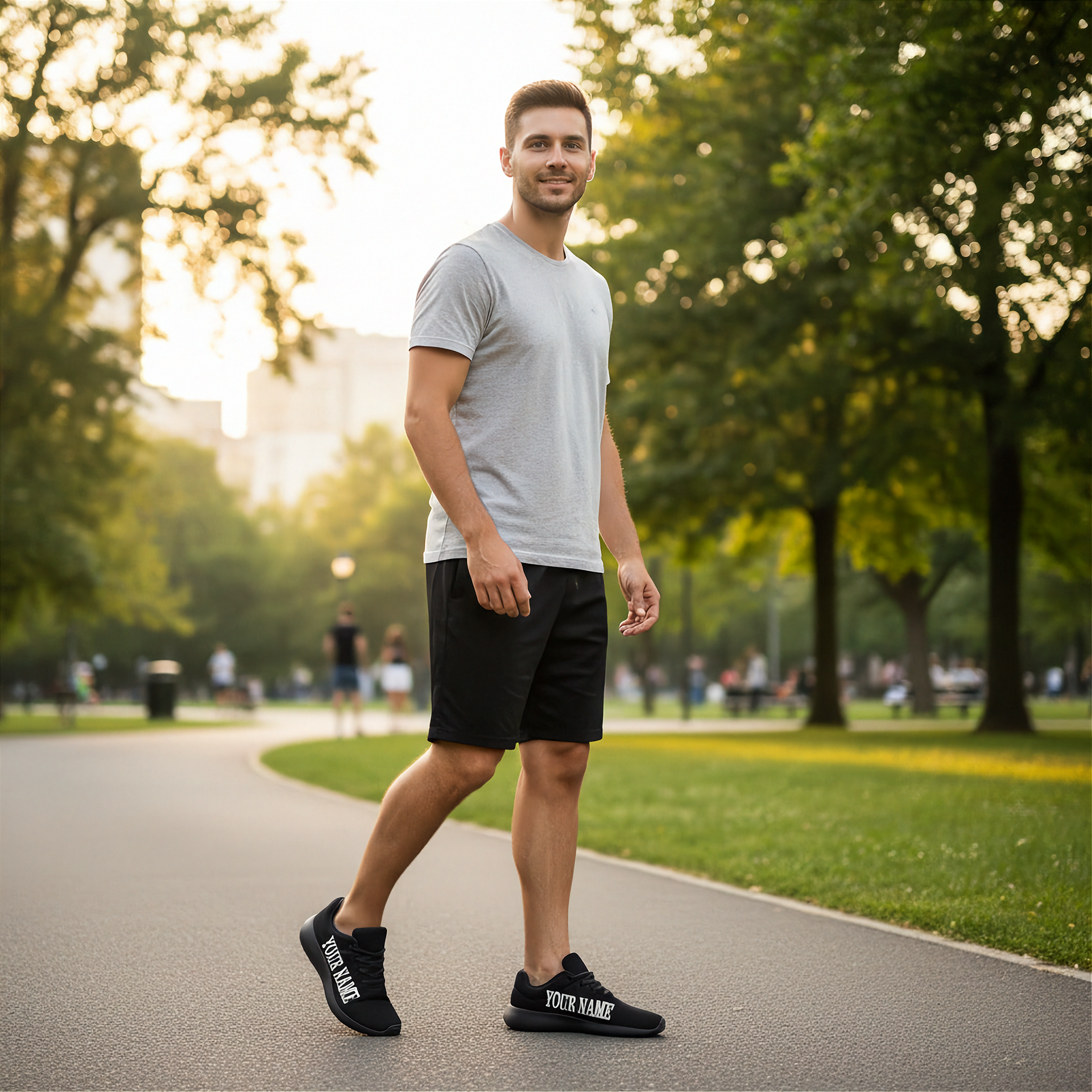 Man walking on a path in a park with trees and people in the background wearing custom shoes