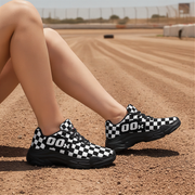 Woman wearing black and white checkered shoes on a dirt track