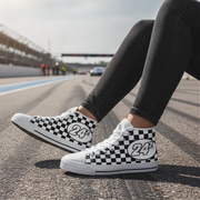 Person wearing checkered high-top sneakers with number 24 on a race track.
