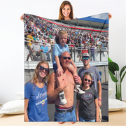 Family photo displayed on a large fabric with a stadium background