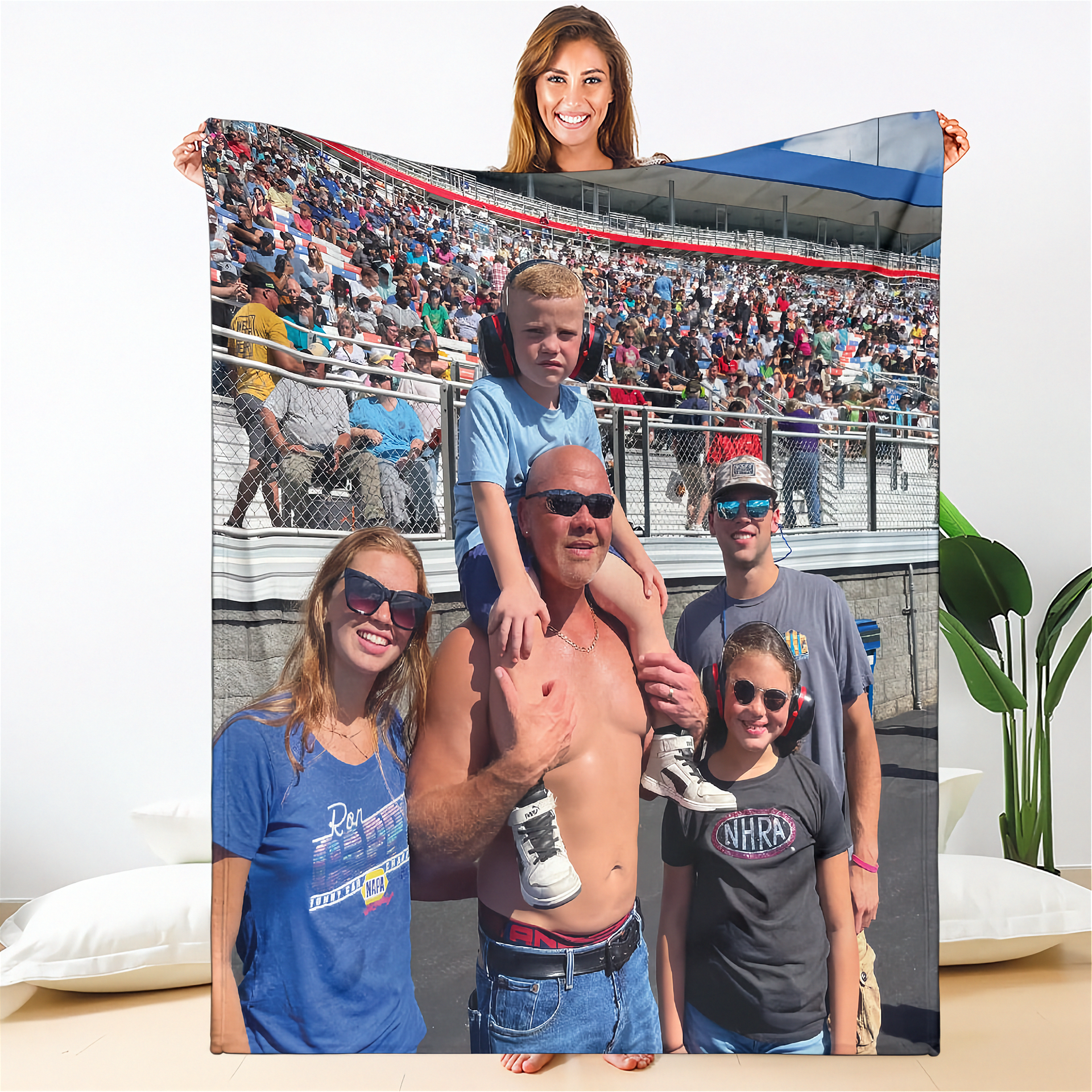 Family photo displayed on a large fabric with a stadium background