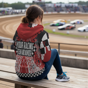 woman sitting at the stands of a dirt track arena wearing a custom racing sherpa jacket