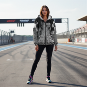 Woman wearing a checkered custom sherpa hoodie and black pants on a race track