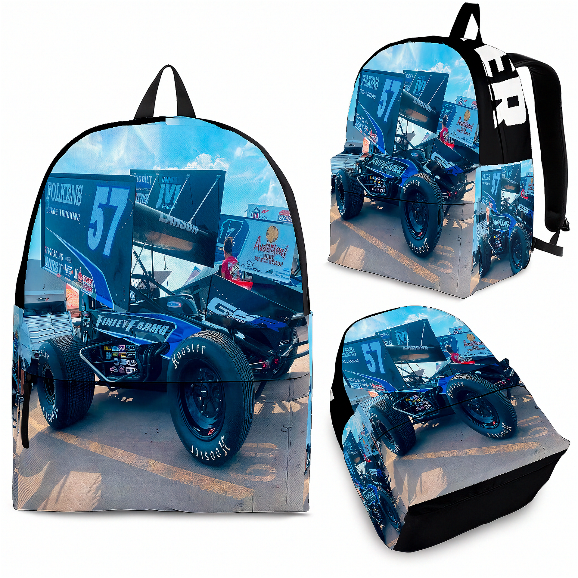 A backpack shown from multiple angles on a white background, featuring a full-color wraparound print of a blue and white race car with racing flags and sky. The backpack has black straps and black trim, and the print includes visible racing sponsor graphics.