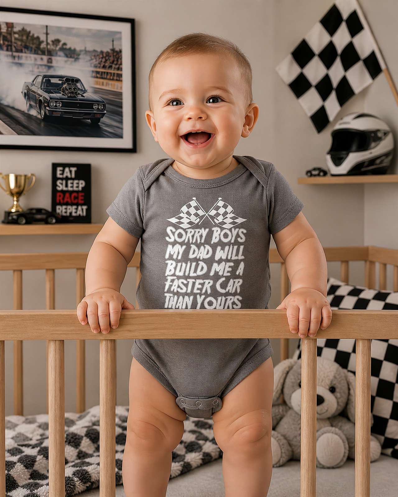 Cute kids racing apparel featuring the bold "Sorry Boys My Dad Will Build Me A Faster Car Than Yours" graphic, available in youth t-shirts, warm hoodies, and soft baby onesies.
