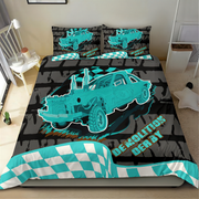 A bed dressed in a racing-themed bedding set featuring a turquoise and black car graphic with the words 'DEMOLITION DERBY' and a checkered border, shown in a bedroom setting.