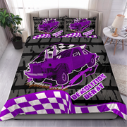 A racing-themed bedding set featuring a red and black checkered pattern, a red race car graphic, and 'DEMOLITION DERBY' text, styled on a bed in a rustic industrial bedroom setting.