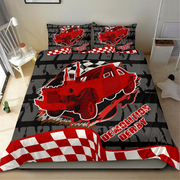 A bed dressed with a racing-themed bedding set featuring a red race car, black and gray checkered pattern, and red-and-white checkered accents. The set includes a duvet cover and two matching pillowcases with the text 'DEMOLITION DERBY'.