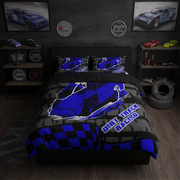 A racing-themed bedding set displayed on a bed in a dark, styled bedroom. The set includes a duvet cover and two matching pillowcases featuring a blue and gray dirt race car graphic with the text 'Dirt Race Racing' and a blue-and-black checkered border.