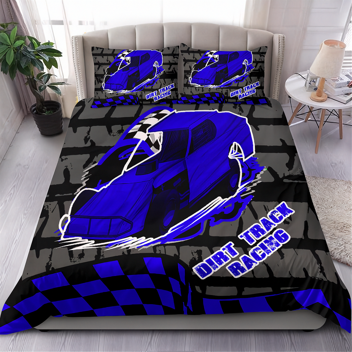 A racing-themed bedding set featuring a duvet cover and two pillowcases with a black and red checkered pattern, yellow lights, and a large illustrated race car on a bed in a bedroom.
