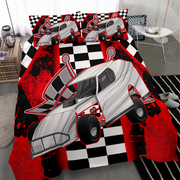 A racing-themed bedding set featuring a duvet cover and matching pillowcases with a large gray race car graphic over a red and black splatter pattern and checkered flag design, shown on a bed in a styled bedroom setting.
