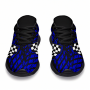 Pair of blue checkered sneakers with black soles on a white background
