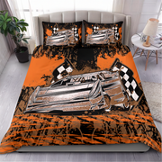 A bedding set featuring a duvet cover and two pillowcases with a stylized graphic of a silver race car on an orange and black splattered background, shown on a bed in a bedroom setting.