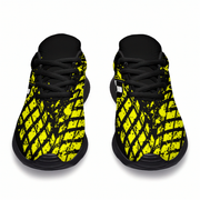 Black and yellow patterned shoes on a white background