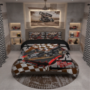A racing-themed bedding set displayed on a bed in a modern, industrial-style bedroom. The set includes a duvet cover and two matching pillowcases featuring a graphic of a black hot track racing car on a white background with brown and black checkered patterns, red accents, and the text 'DIRT TRACK RACING'.