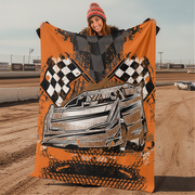 Woman wearing a black hoodie with text in a dirt track setting