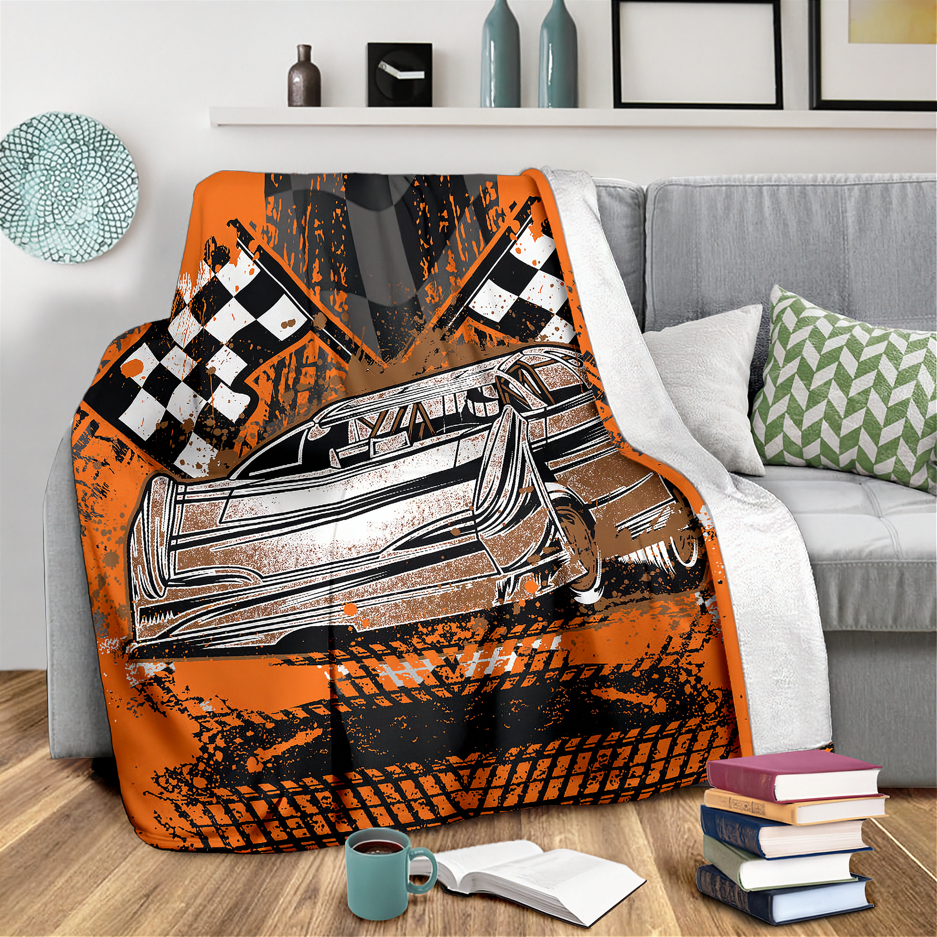 Decorative blanket with a car and racing flags design on a couch in a living room.