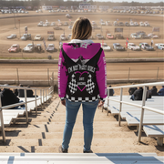 Woman wearing a pink sherpa hoodie with 'I'm Not Most Girls Dirt Racing' text at a dirt track.