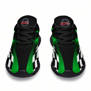 A pair of black athletic sneakers with vibrant green paint splatter details, white and black checkered side panels, and a circular red and black 'BLOOD' logo on the tongue.