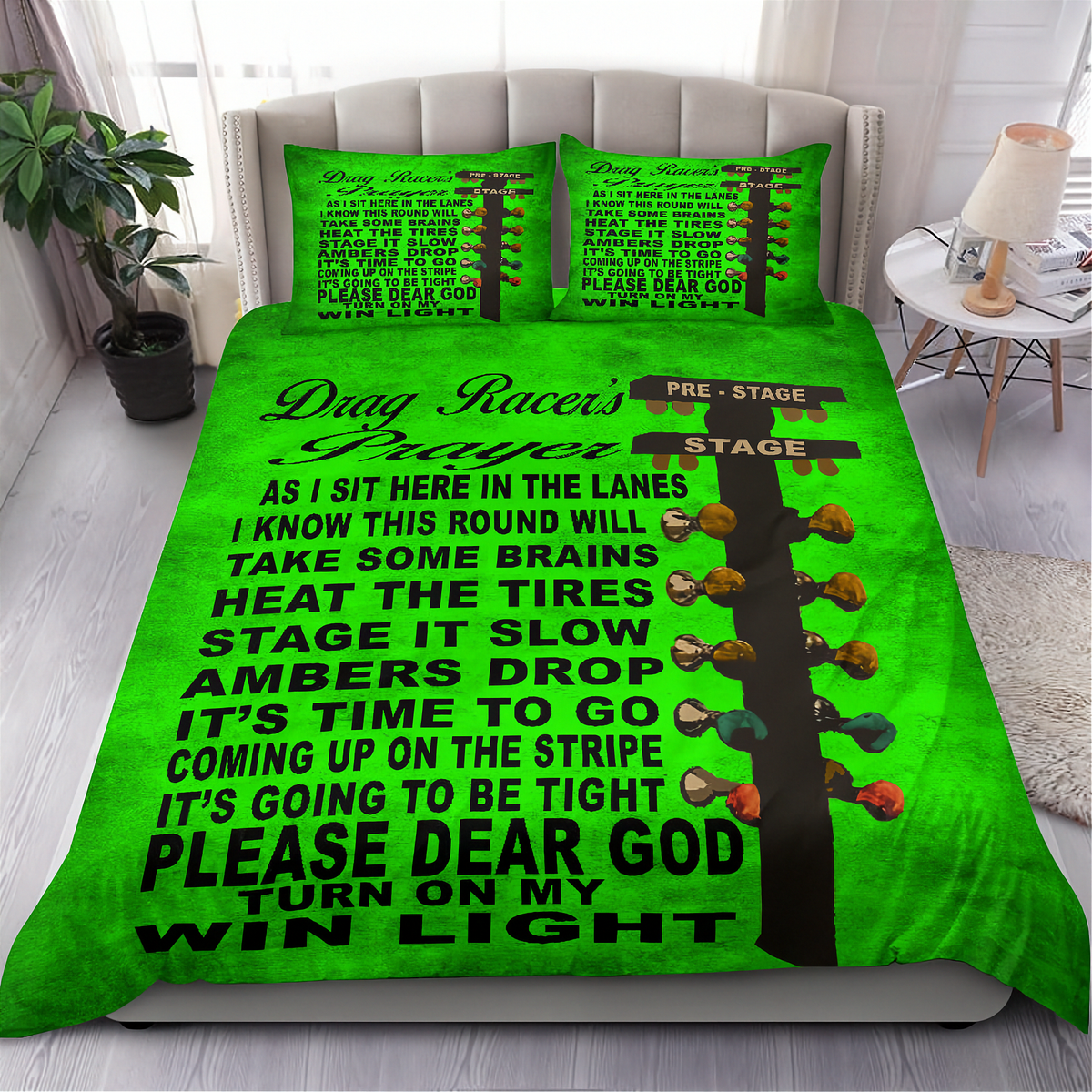 A bright green bedding set with a 'Drag Racer's Prayer' graphic printed on the comforter and two matching pillowcases, shown on a bed in a modern bedroom setting.